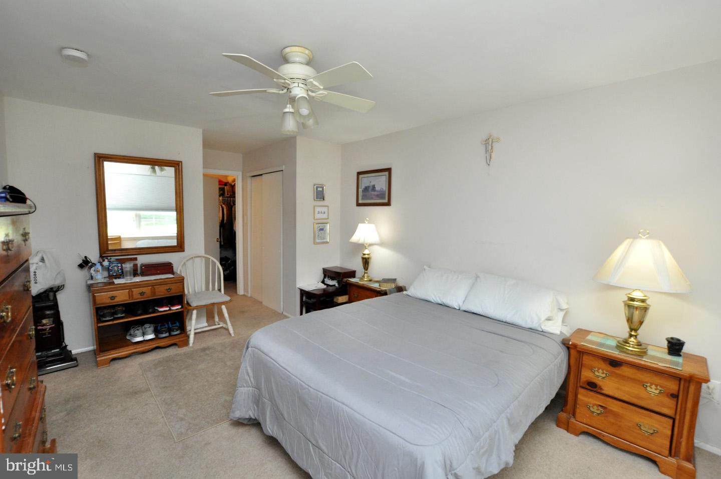1505 Squirrel Road Evesham, NJ 08053 - Photo 18 of 23 a bedroom with a bed and a chandelier