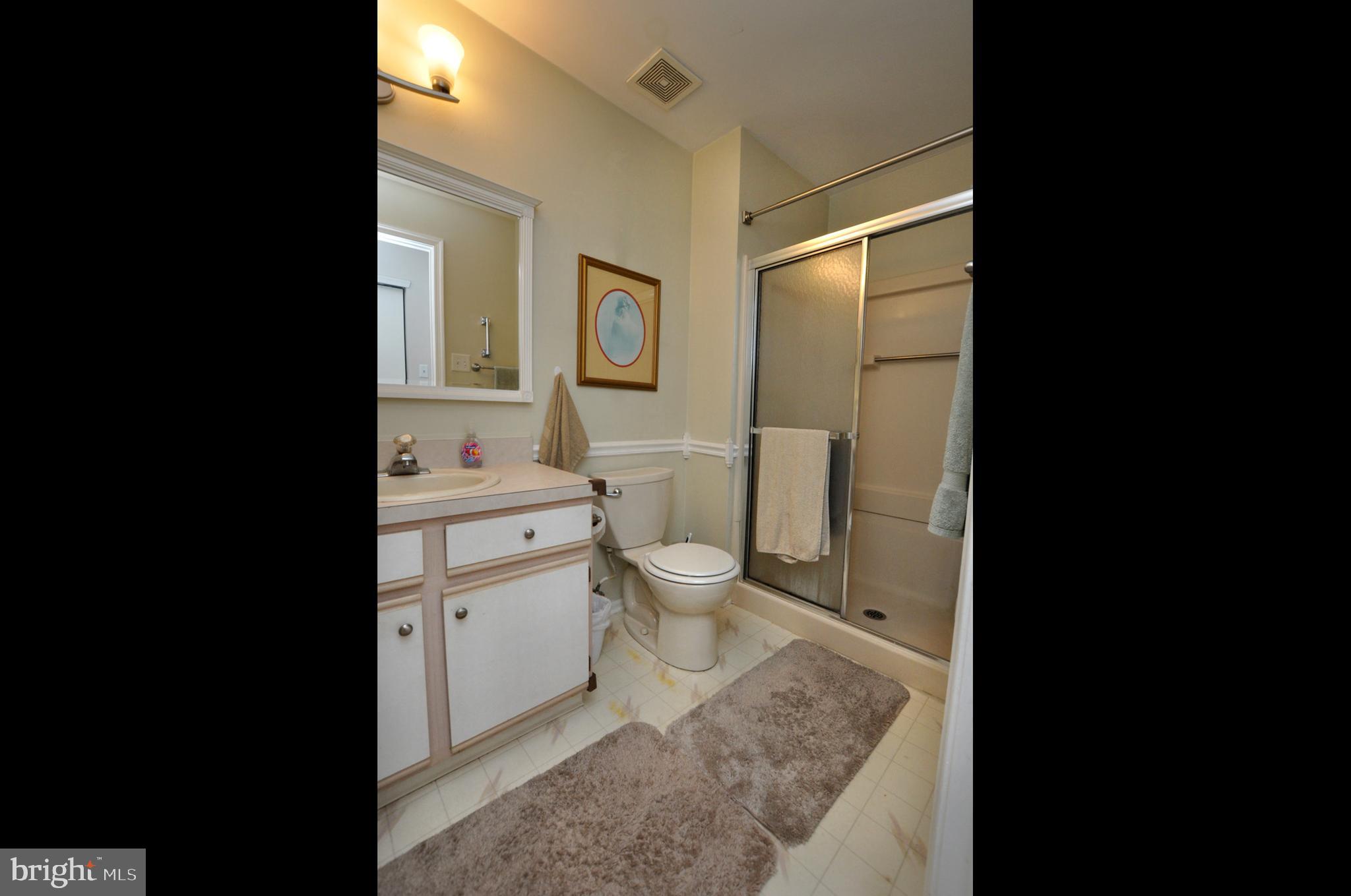 1505 Squirrel Road Evesham, NJ 08053 - Photo 20 of 23 a bathroom with a granite countertop sink toilet and shower