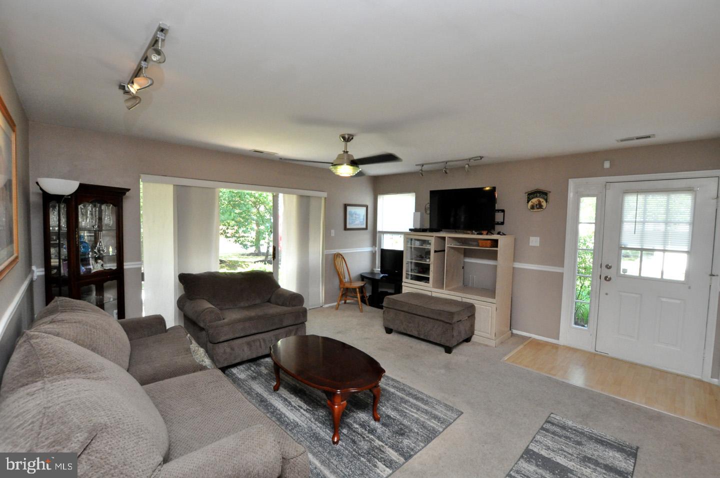 1505 Squirrel Road Evesham, NJ 08053 - Photo 6 of 23 a living room with furniture and a flat screen tv