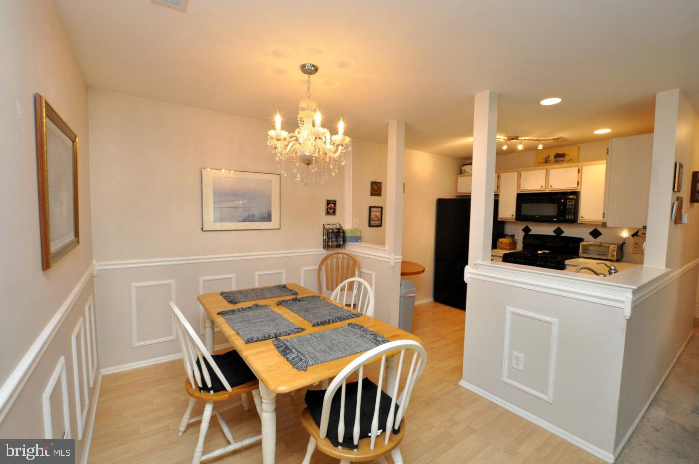 1505 Squirrel Road Evesham, NJ 08053 - Photo 7 of 23 a dining room with furniture and chandelier