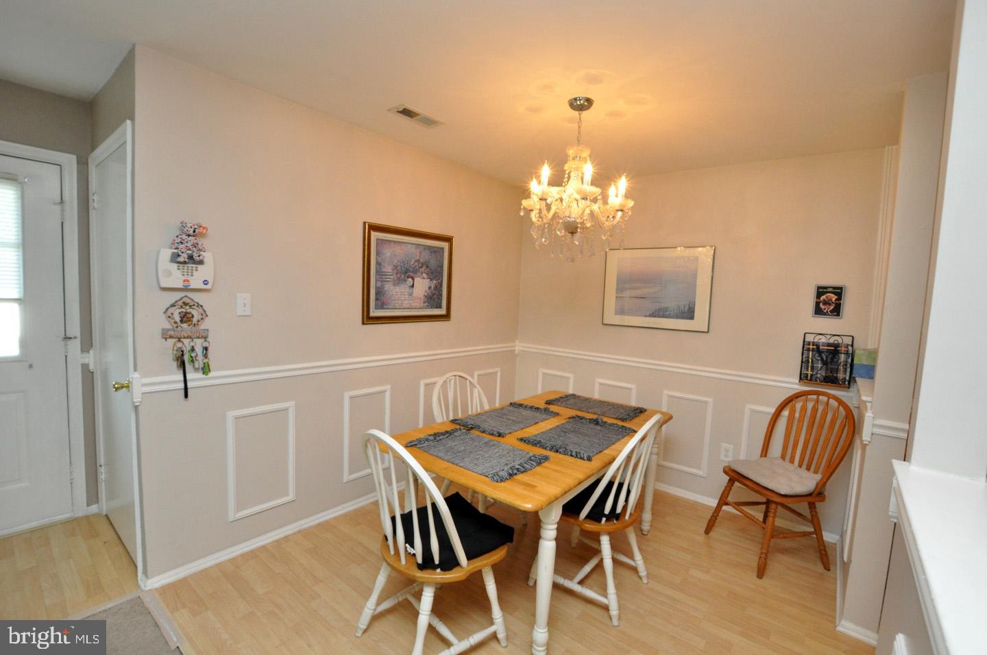 1505 Squirrel Road Evesham, NJ 08053 - Photo 8 of 23 a view of a dining room with furniture and chandelier