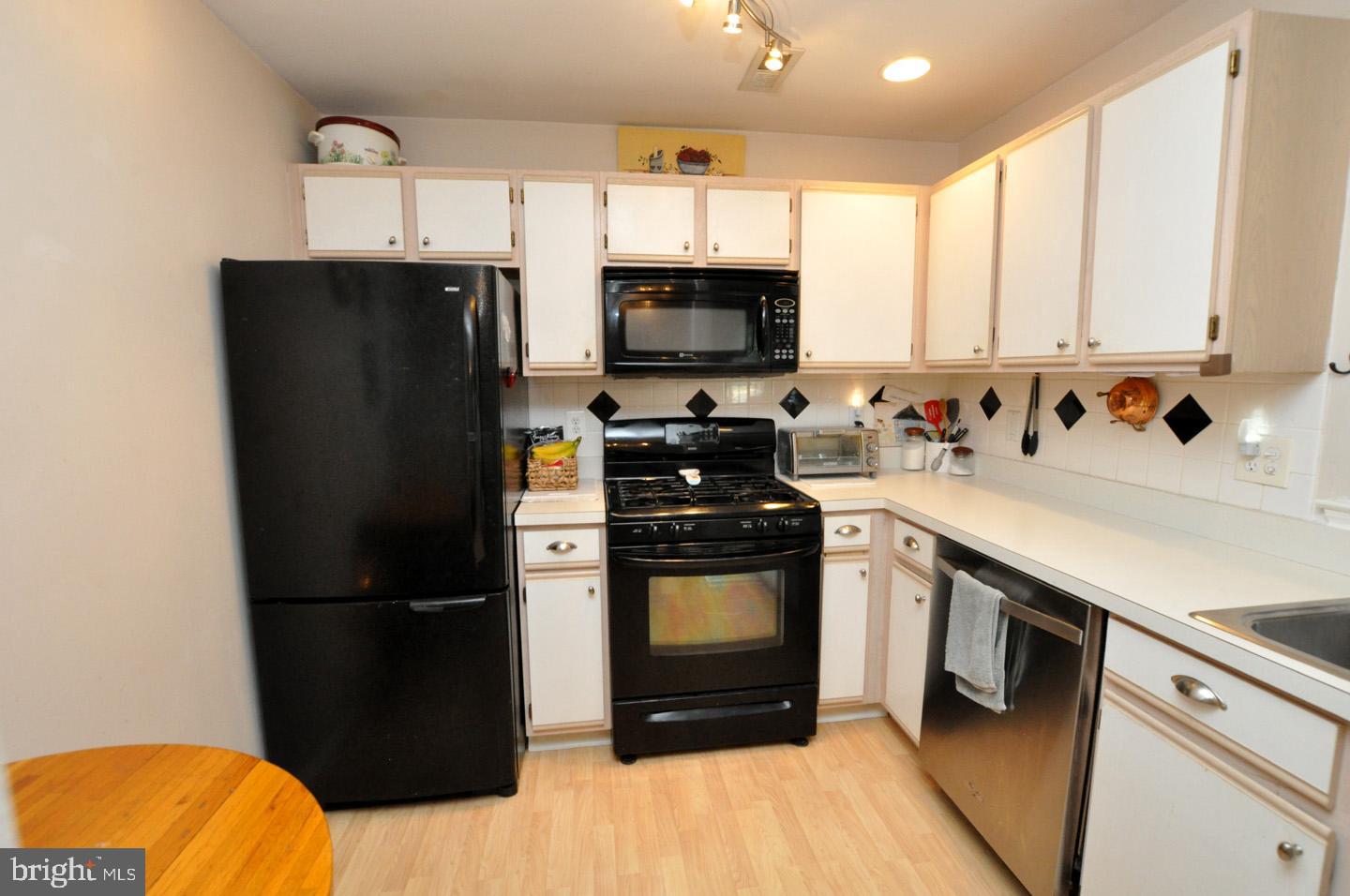 1505 Squirrel Road Evesham, NJ 08053 - Photo 10 of 23 a kitchen with a refrigerator sink and microwave