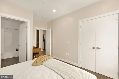 a bedroom with a bed and a closet