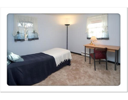 190 Center Depot Road Charlton, MA 01507 - Photo 10 of 18 a bedroom with a bed window and table