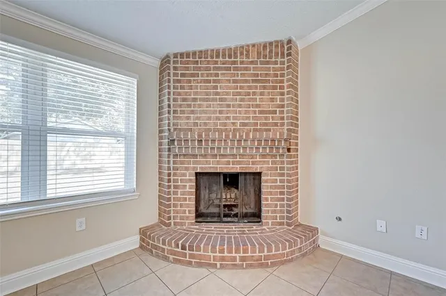 a living room with a fireplace and a table