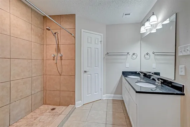 a bathroom with a sink a vanity and a mirror