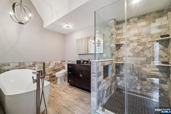 a bathroom with a bathtub and shower