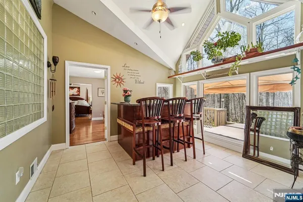 a dining room with furniture and chandelier