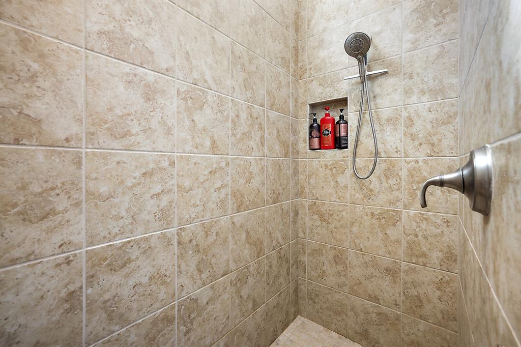 5129 Jared's Landing Way Oxford, FL 34484 - Photo 23 of 41 a bathroom with a shower