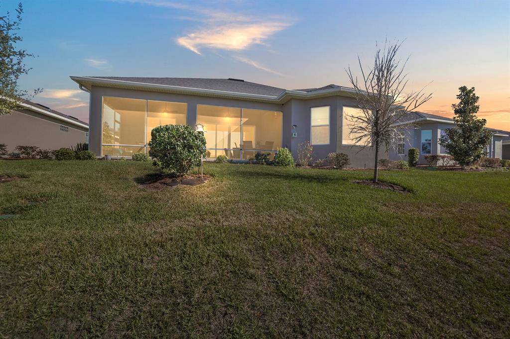 5129 Jared's Landing Way Oxford, FL 34484 - Photo 36 of 41 a view of a house with a big yard and large trees