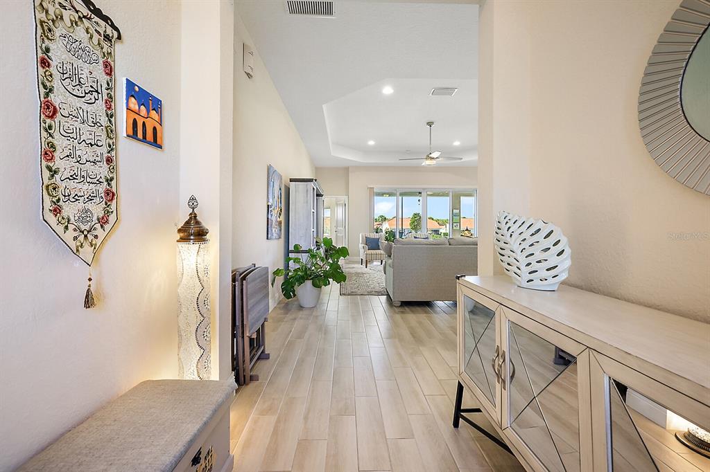 5129 Jared's Landing Way Oxford, FL 34484 - Photo 7 of 41 a view of kitchen with furniture and wooden floor