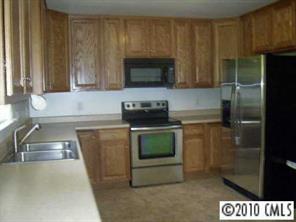 739 Stone Road Salisbury, NC 28146 - Photo 3 of 8 a kitchen with a sink and a stove top oven