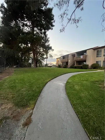 a view of a patio with a yard