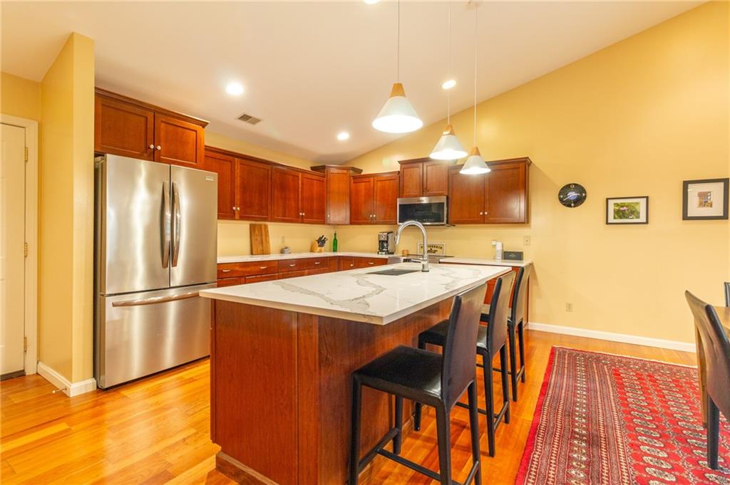138 Abbey Road New Castle, PA 16105 - Photo 20 of 36 a kitchen with stainless steel appliances a refrigerator and a stove