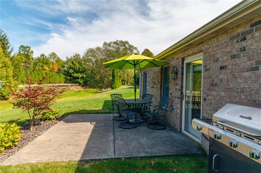 138 Abbey Road New Castle, PA 16105 - Photo 33 of 36 a view of a patio with a table chairs and a garden