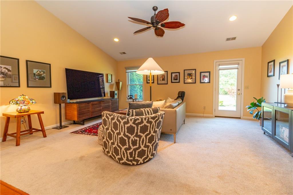 138 Abbey Road New Castle, PA 16105 - Photo 4 of 36 a living room with furniture a flat screen tv and kitchen view