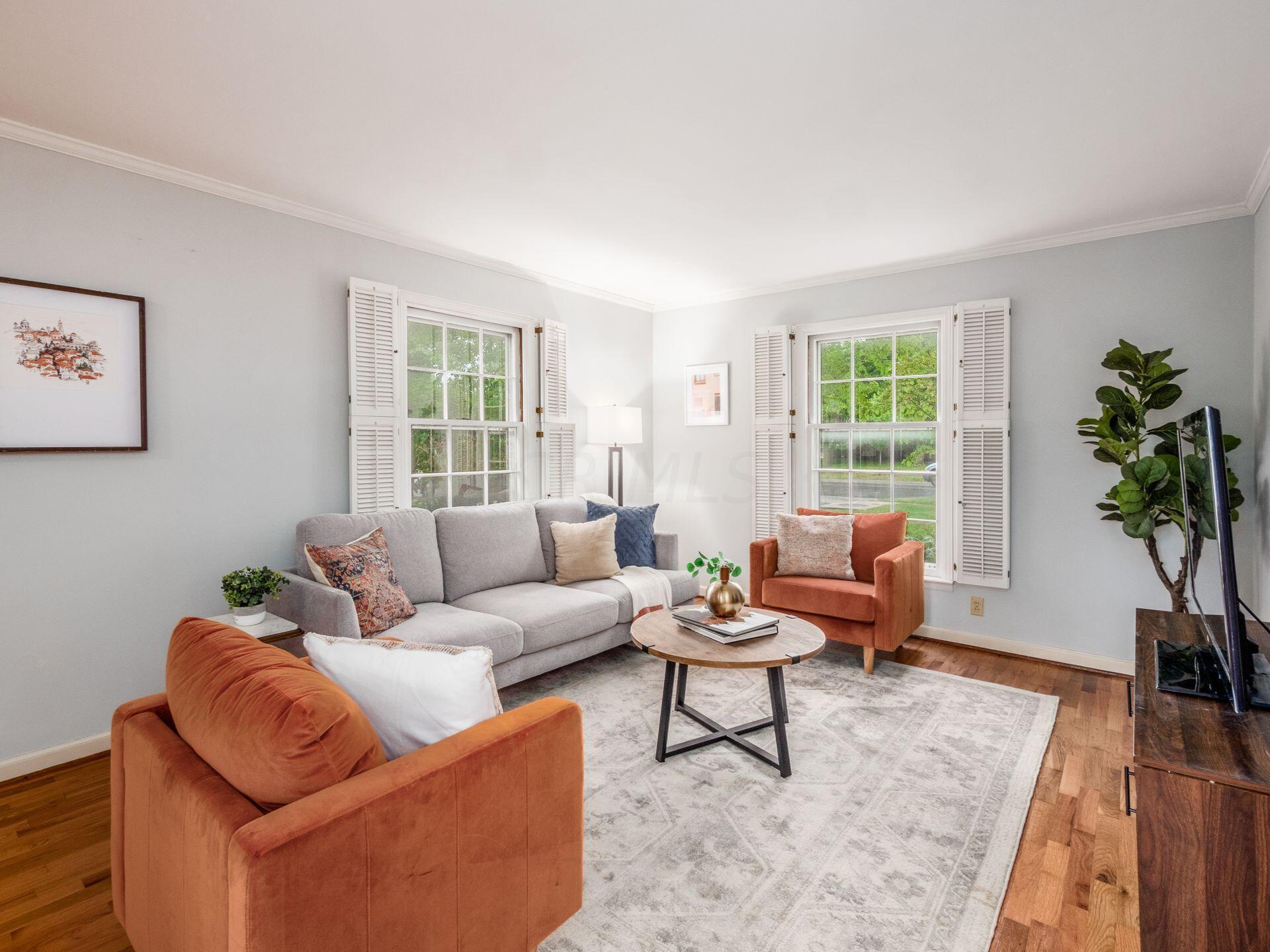1631 Roxbury Road, Unit A2 Columbus, OH 43212 - Photo 8 of 38 The living room features hardwood floors, plantation shutters and crown molding!