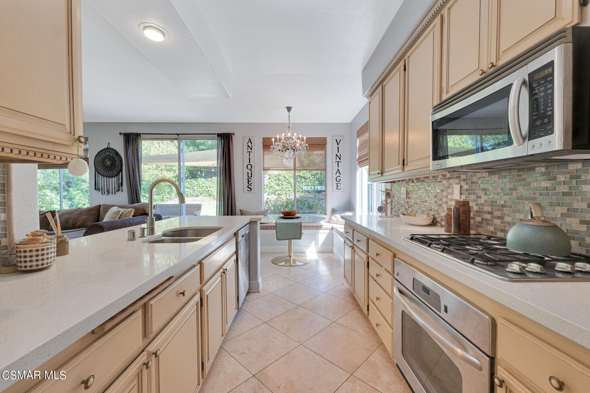 3930 Sunsetridge Road Moorpark, CA 93021 - Photo 13 of 42 a kitchen with a sink stove and cabinets