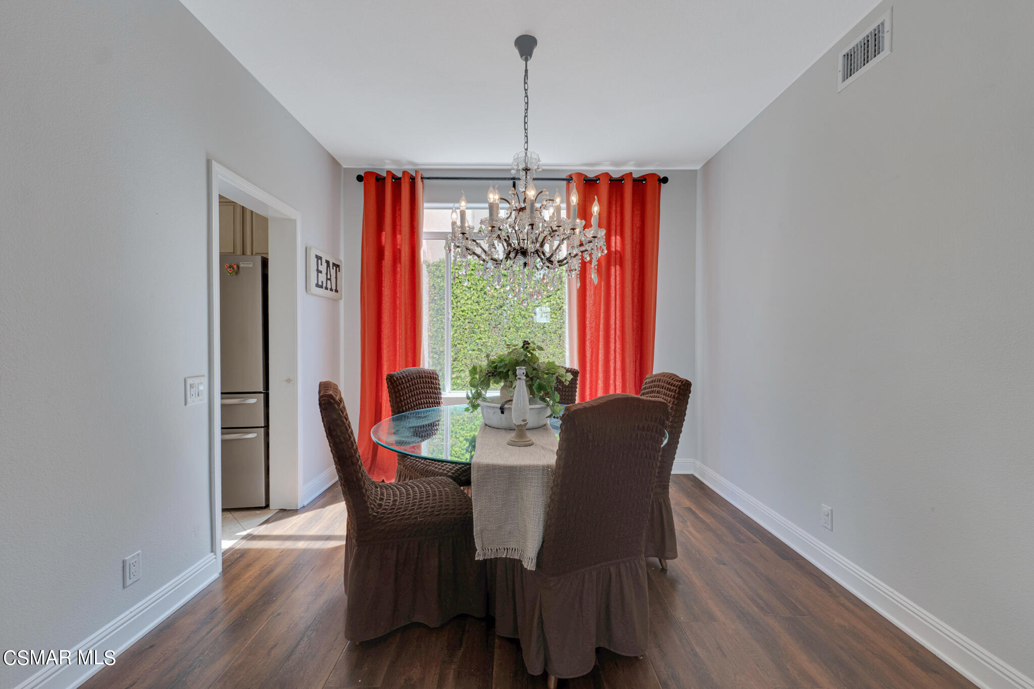 3930 Sunsetridge Road Moorpark, CA 93021 - Photo 10 of 42 a dining room with furniture a chandelier and wooden floor