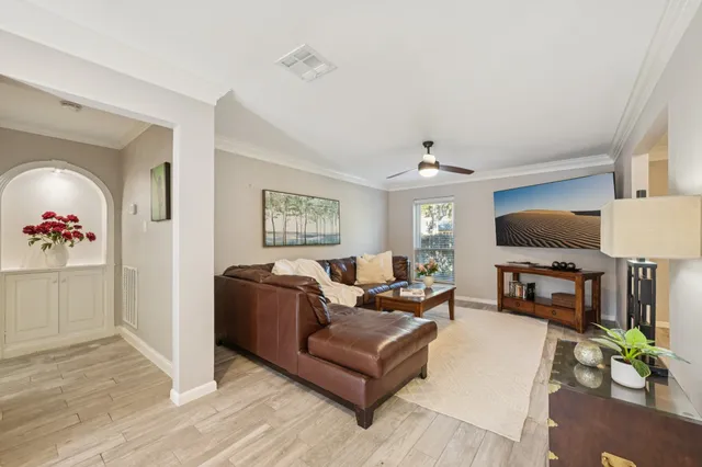 a dining room with furniture and wooden floor
