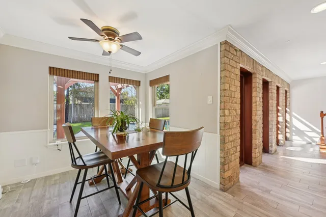 a kitchen with stainless steel appliances kitchen island granite countertop a sink and cabinets
