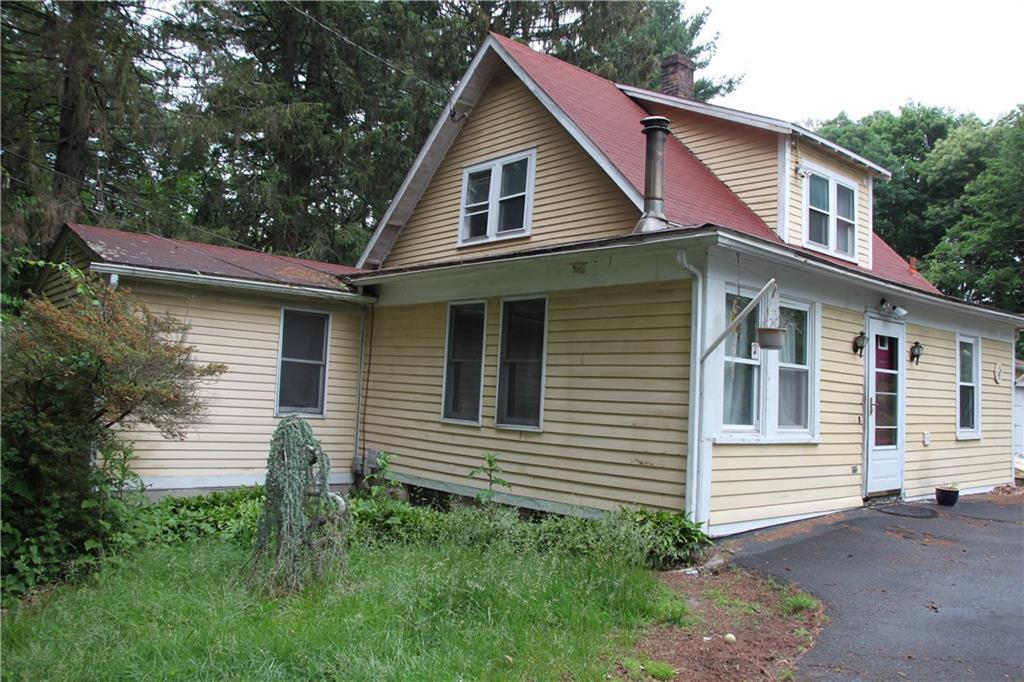 7 Leffert Road Trumbull, CT 06611 - Photo 1 of 1 a view of a house in front of a yard with plants and large tree