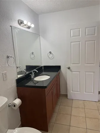 a bathroom with a sink a toilet and a bathtub