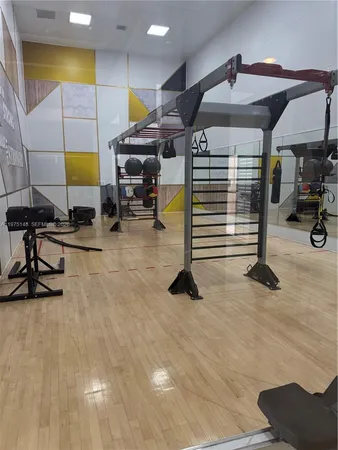 an room with pool tables and windows