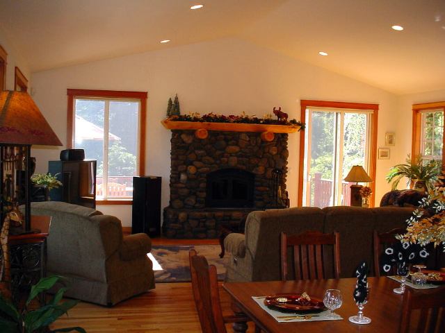 1005 Nottingham Way Tahoe Vista, CA 96148 - Photo 3 of 7 a living room with furniture a fireplace and a large window
