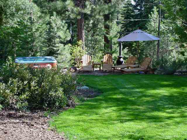 1005 Nottingham Way Tahoe Vista, CA 96148 - Photo 6 of 7 a view of a house with a yard and sitting area