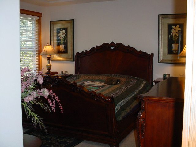 1005 Nottingham Way Tahoe Vista, CA 96148 - Photo 7 of 7 a bed sitting in a bedroom next to a window