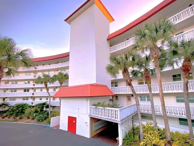 a front view of a house with yard and outdoor seating