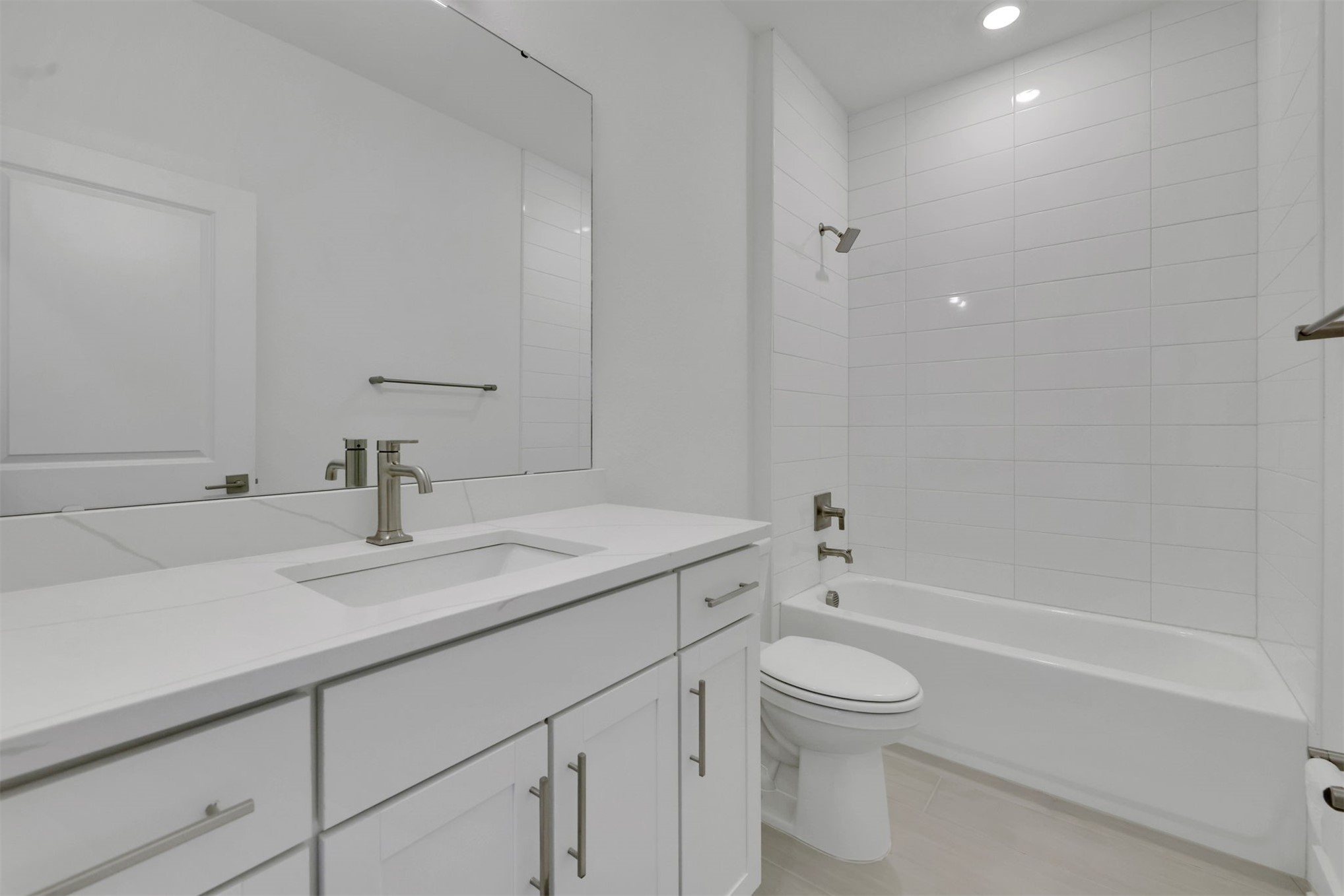 96040 Pirates Bluff Road Yulee, FL 32097 - Photo 10 of 38 a bathroom with a granite countertop sink a toilet and a bathtub