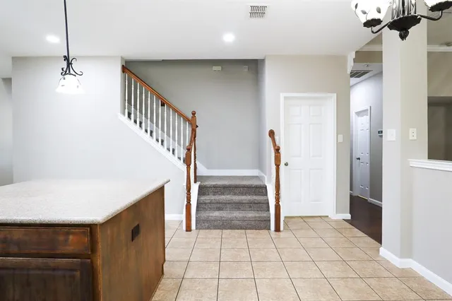 a view of entryway and hall with a dining table