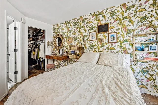 a bathroom with a sink toilet vanity and shower