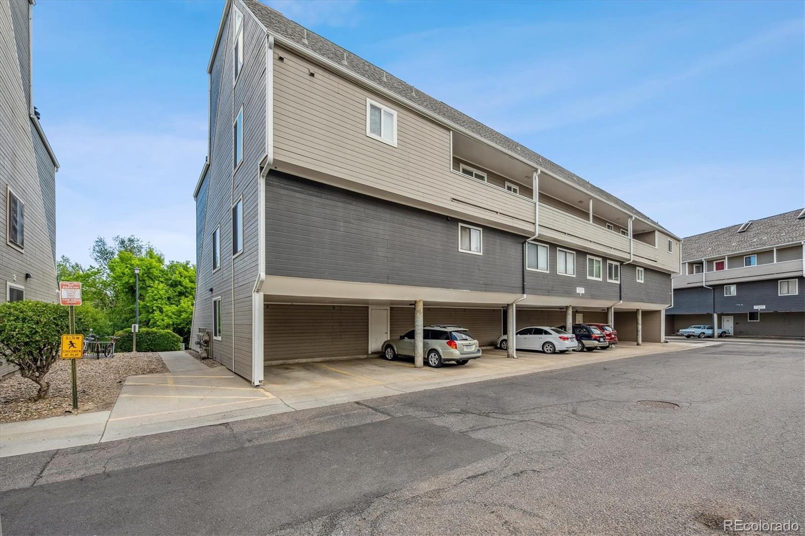 5250 South Huron Way, Unit 7104 Littleton, CO 80120 - Photo 13 of 19 a car parked in front of a building