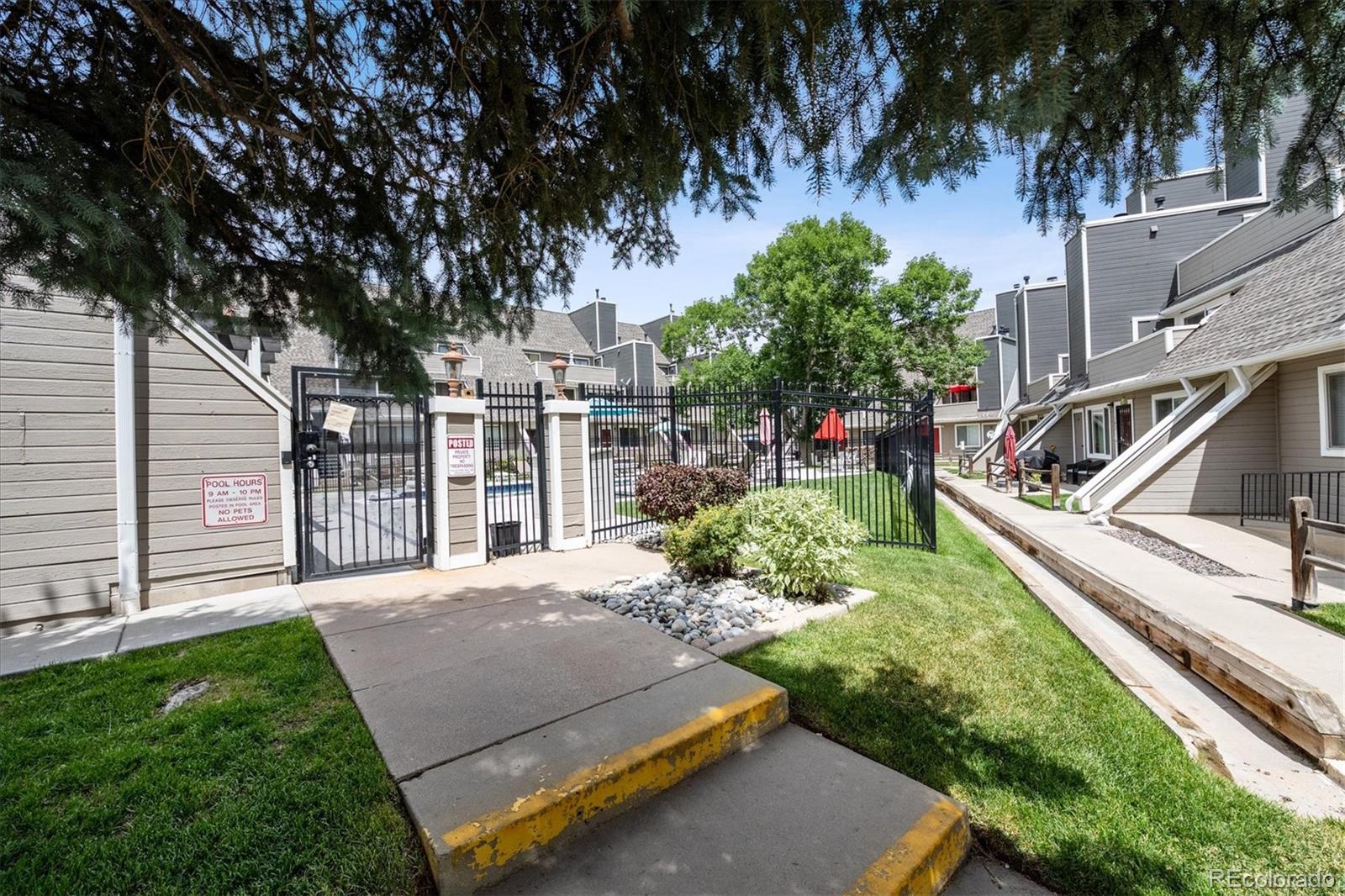 5250 South Huron Way, Unit 7104 Littleton, CO 80120 - Photo 14 of 19 a view of a backyard with a garden and trees