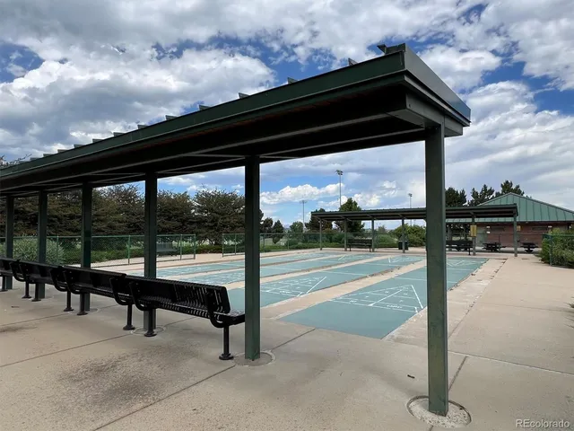 a view of a golf course with a lake view
