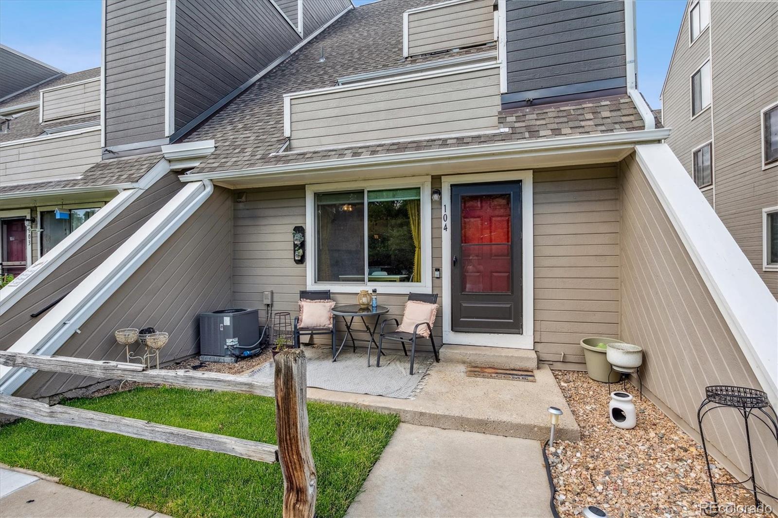 5250 South Huron Way, Unit 7104 Littleton, CO 80120 - Photo 2 of 19 a backyard of a house with outdoor seating