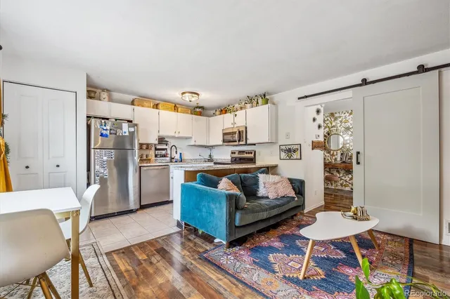 a living room with furniture and a rug