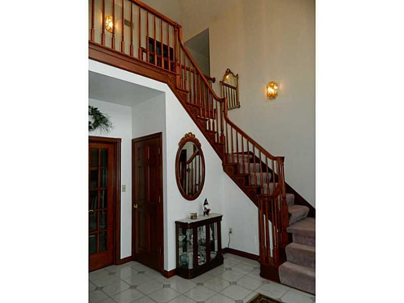 318 Quarry Road Washington, PA 15301 - Photo 5 of 25 Exterior Front. The large two story foyer boasts a grand staircase. Stained wood trim and 6 panel door throughout the home.