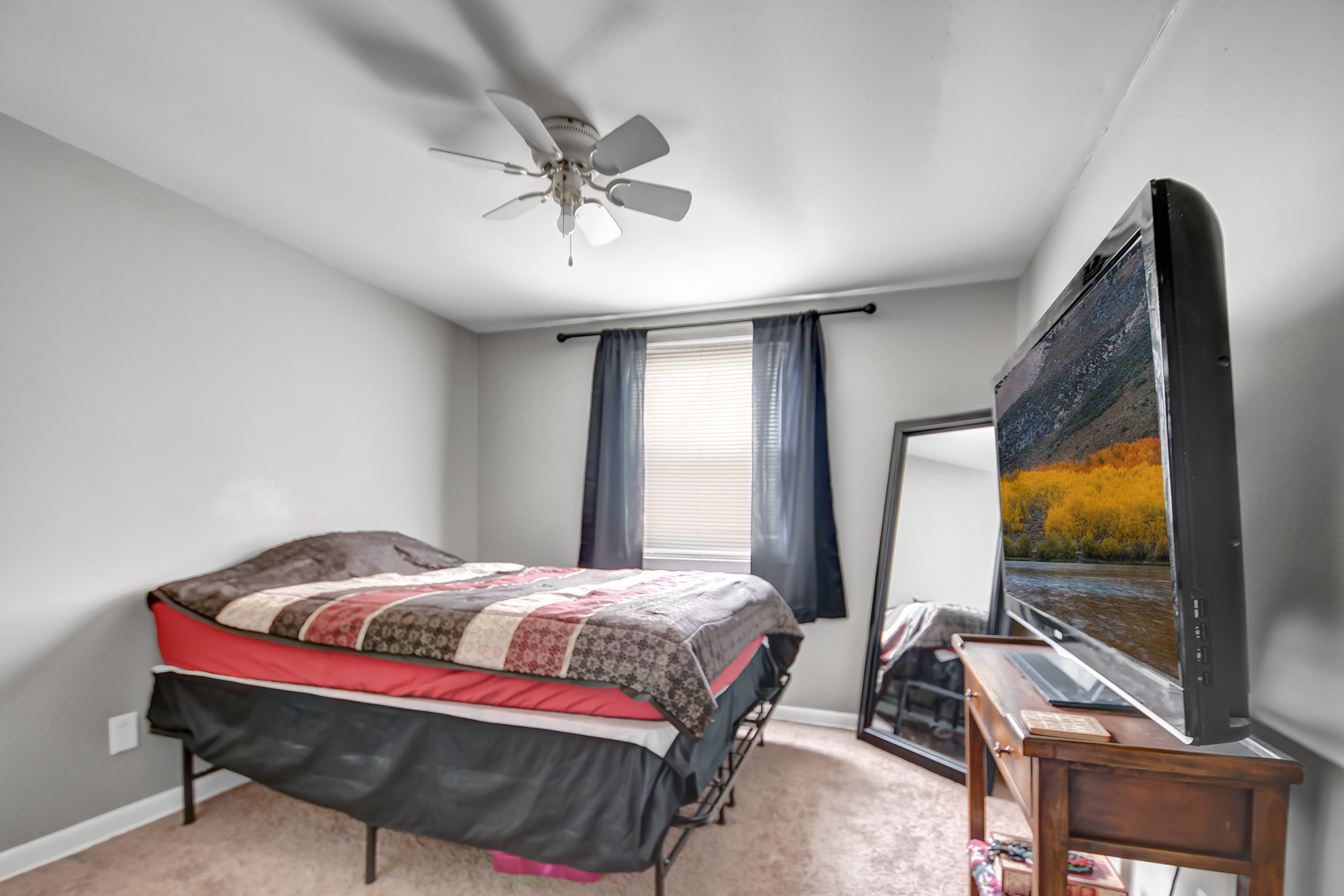 15047 Copter Lane Romeoville, IL 60446 - Photo 12 of 18 a bedroom with a bed and glass windows