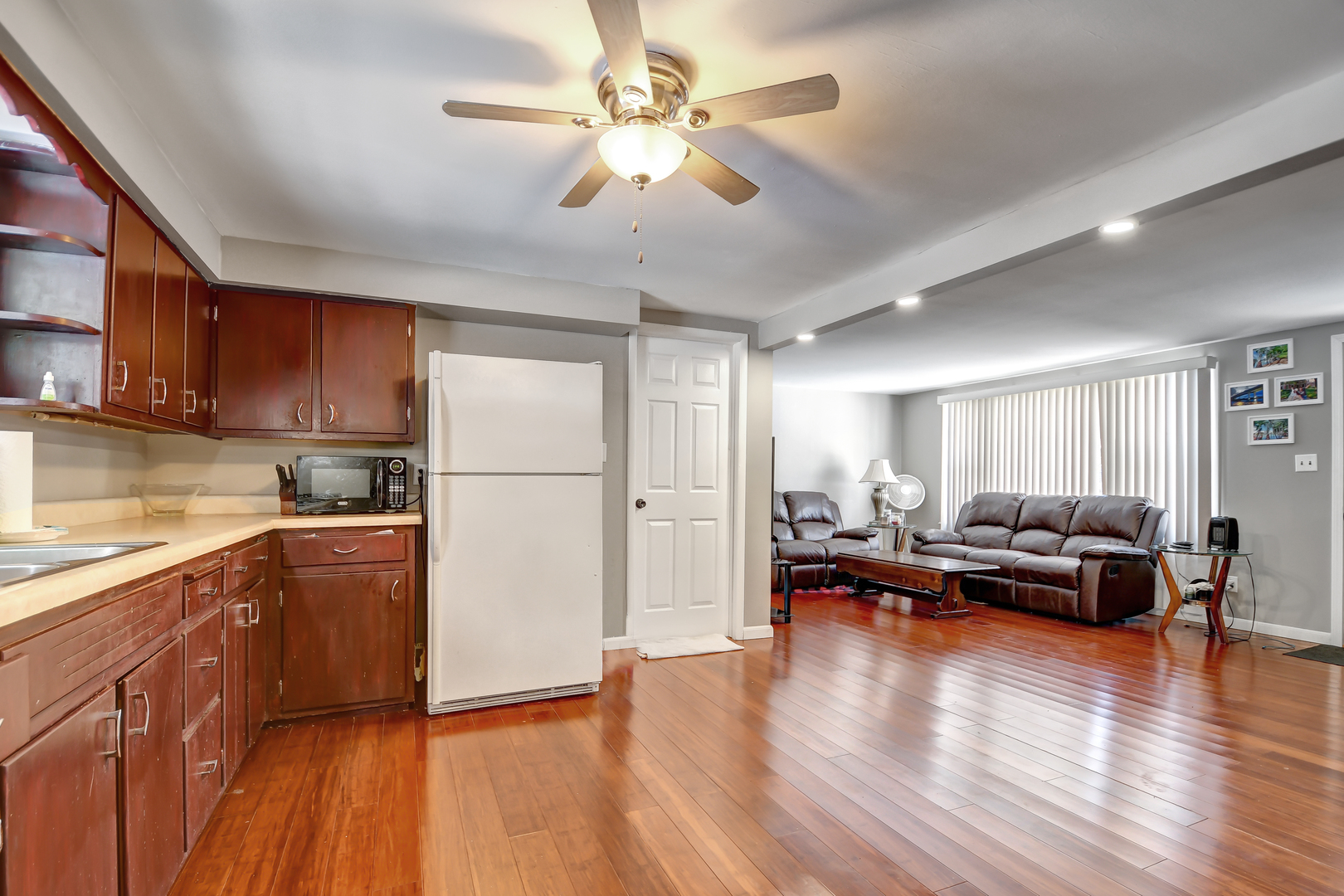 15047 Copter Lane Romeoville, IL 60446 - Photo 8 of 18 a living room with stainless steel appliances granite countertop furniture wooden floor and a kitchen view