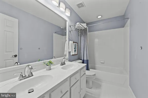 a view of an empty room with a cabinet