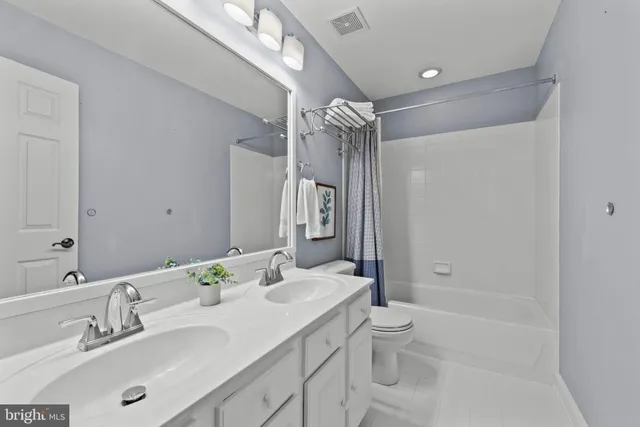 a view of an empty room with a cabinet