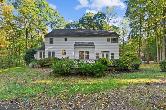 a view of outdoor space with deck and yard