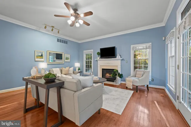 a view of a livingroom with furniture window and wooden floor