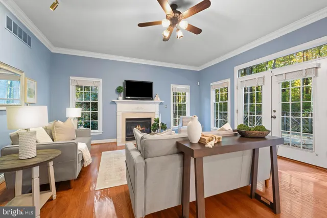 a kitchen with stainless steel appliances granite countertop a stove a sink a oven a dining table and chairs