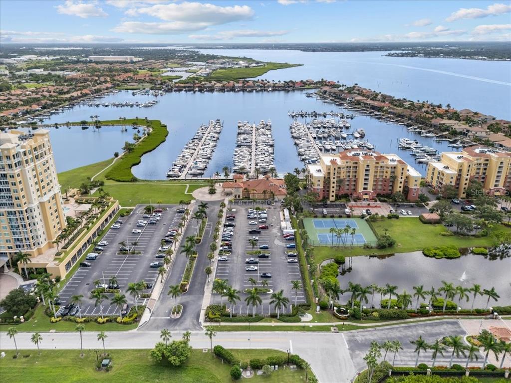 102 Riviera Dunes Way, Unit S36 Palmetto, FL 34221 - Photo 11 of 24 an aerial view of a city with lots of residential buildings and lake view