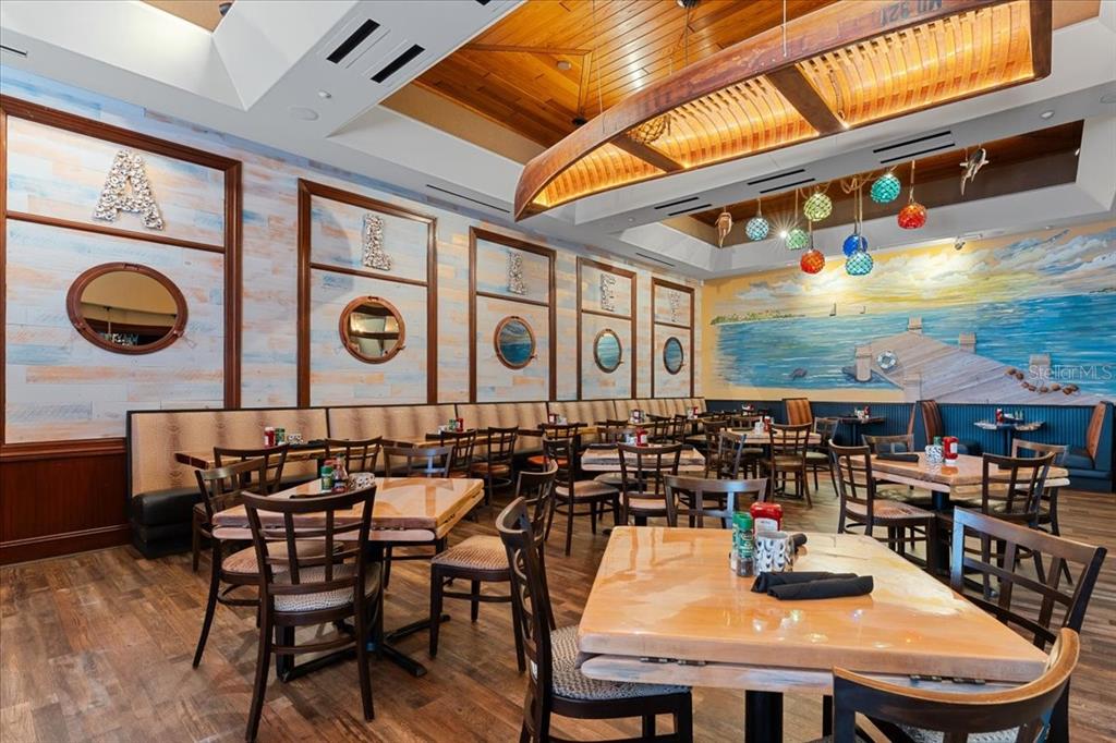 102 Riviera Dunes Way, Unit S36 Palmetto, FL 34221 - Photo 18 of 24 a outdoor dining space with furniture and outdoor view